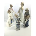 A collection of five Nao figures of children with