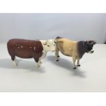 A Beswick Hereford cow and Jersey cow. No obvious