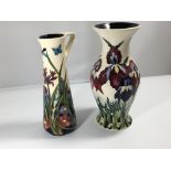 A Moorcroft jug decorated with thistle a d wild fl