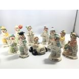 A collection of eleven Beswick clown figures most
