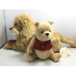 A Steiff Winnie the Pooh bear and a Lion King Steiff both with hanging tags in very good condition (