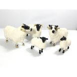 A collection of Beswick sheep including two Rams a