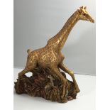 A limited edition Resin sculpture of a giraffe Fro