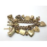 A 9ct gold charm bracelet with a rose gold bracele