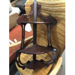 A Edwardian mahogany corner shelf with three open