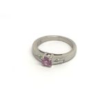 An 18carat gold ring set with a pink sapphire and