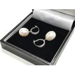 A pair of 9ct white gold Pearl and diamond drop ea