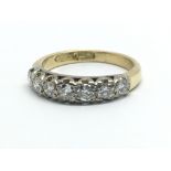 A 1940s 18ct yellow gold and seven stone diamond r