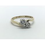 A 9ct yellow gold ring having two diamonds, approx