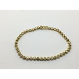 An 18ct gold bracelet set with diamonds, approx 1c