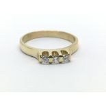 An 18ct yellow gold three stone diamond ring, appr