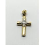 An 18ct gold diamond set cross pendant, approx 2.7
