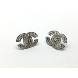 A pair of 14ct white gold diamond set earrings, ap