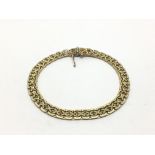 A 9ct gold bracelet with woven links, approx 12.5g