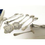 A collection of silver spoons sugar tongs a Chines