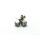 A pair of 18ct white gold diamond earrings, approx