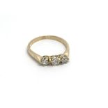 An 18carat gold ring set with three brilliant cut