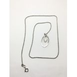 A 9ct white gold pendant set with diamonds, approx