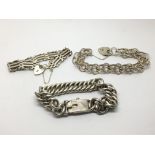 A silver gate bracelet and two other silver bracel