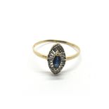 An 18ct gold ring set with a central blue sapphire