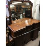 A Victorian walnut sideboard with a raised mirrore