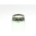 An 18ct white gold ring set with four brilliant cu
