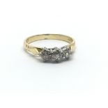 An 18ct yellow gold and three stone diamond ring,