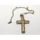 A 9ct gold cross on chain, approx length of cross