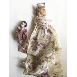 A small bisque early 20th Century doll and one oth