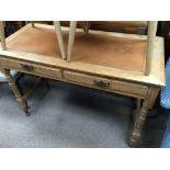 A satinwood late Edwardian desk with an inset leat