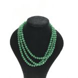 A 872ct three strand polished emerald bead necklac