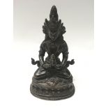 A Tibetan bronze Figure of a seated Tara holding a