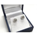 A pair of 14ct white gold solitaire studs approx 1