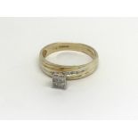 A 14carat gold ring set with four diamonds. ring s