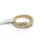 An 18carat gold ring set with six diamonds total c