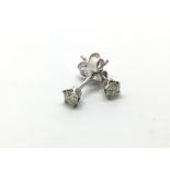 A pair of 18ct white gold diamond stud earrings, a