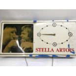 A Stella Artois clock advertisement sign together