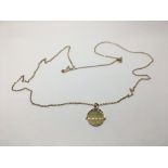 A 9ct gold pendant on chain, approx 3.2g.