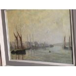 A framed oil on canvas depicting fishing boats and