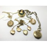 A collection of rolled gold lockets and pendants.