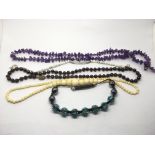 An ivory bead necklace, amethyst necklace etc.