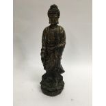 A Chinese bronze figure of a standing Buddha 28 cm