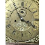 A mahogany case long case clock The brass dial wit