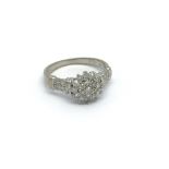 A 9ct white gold diamond cluster ring, approx 1/2c