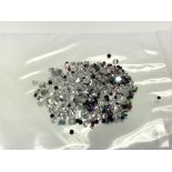 A bag of loose mixed stones including ruby, emeral