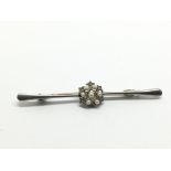A white gold brooch set with small chip stones and