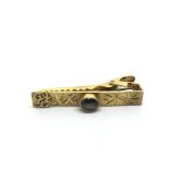 A 14k gold tie clip, approx 4g.
