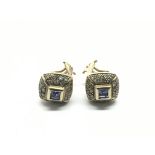 A pair of 18ct gold tanzanite and diamond earrings