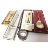 A cased silver seal top spoon one other modern des