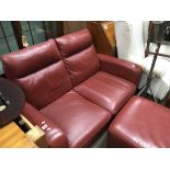 A red leather modern design 2 seater sofa plus a m